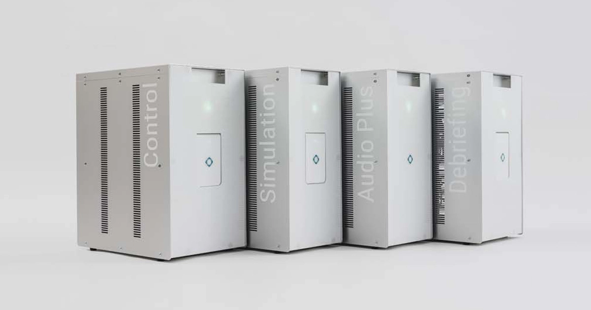 Four modular electronic units labeled Control, Simulation, Audio Plus, and Debriefing, forming integrated medical training system.