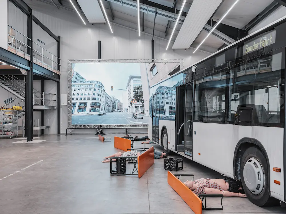 Professional simulation facility with an immersive video wall and bus prop for mass casualty incident (MCI) training and evaluation.